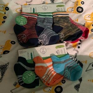 Two packs of Robeez infant socks. 12 pairs total.